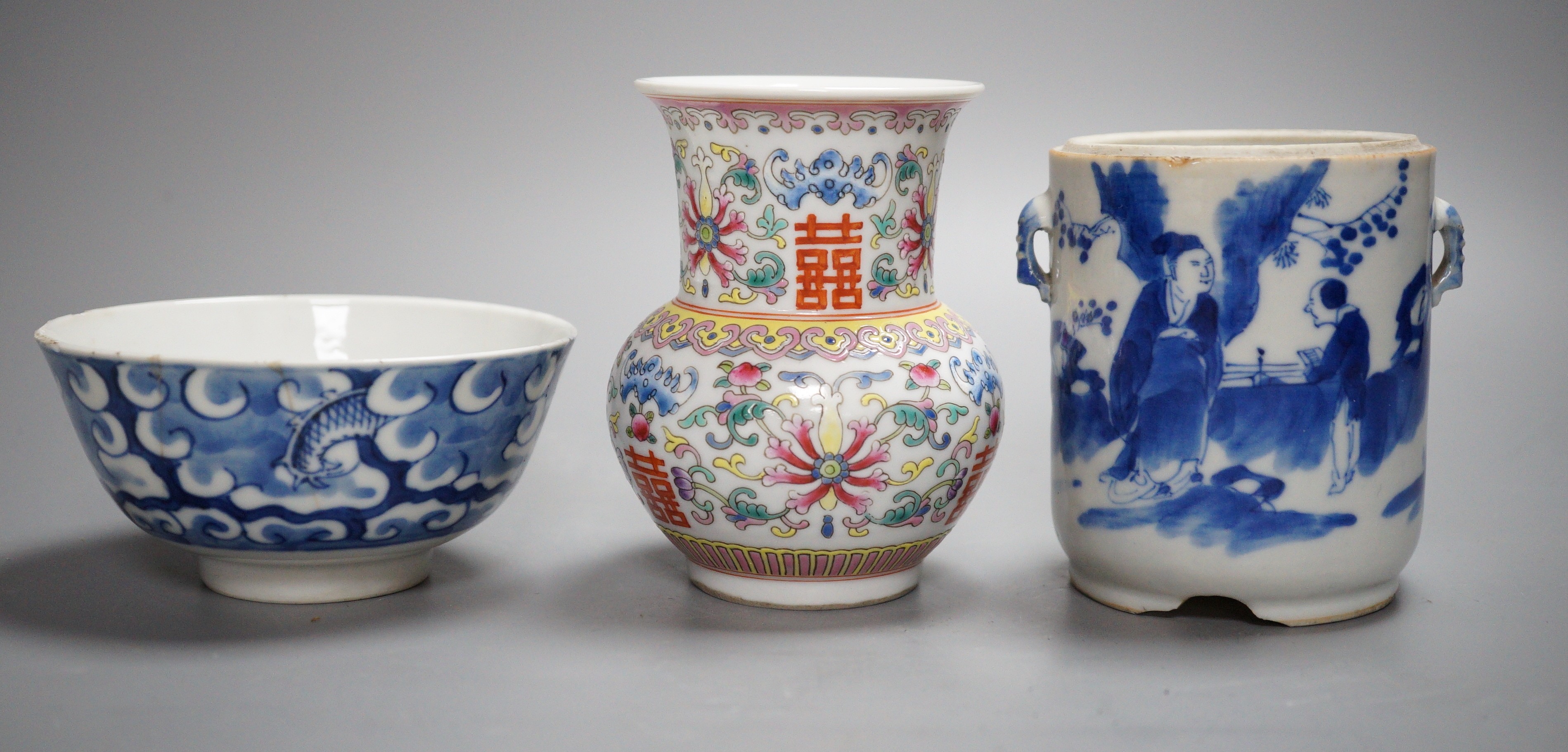 An early 20th century Chinese famille rose vase, a Chinese blue and white jar, lacking cover and a blue and white bowl